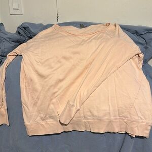 Light peach sweat shirt, size medium but fits more like a large on me.